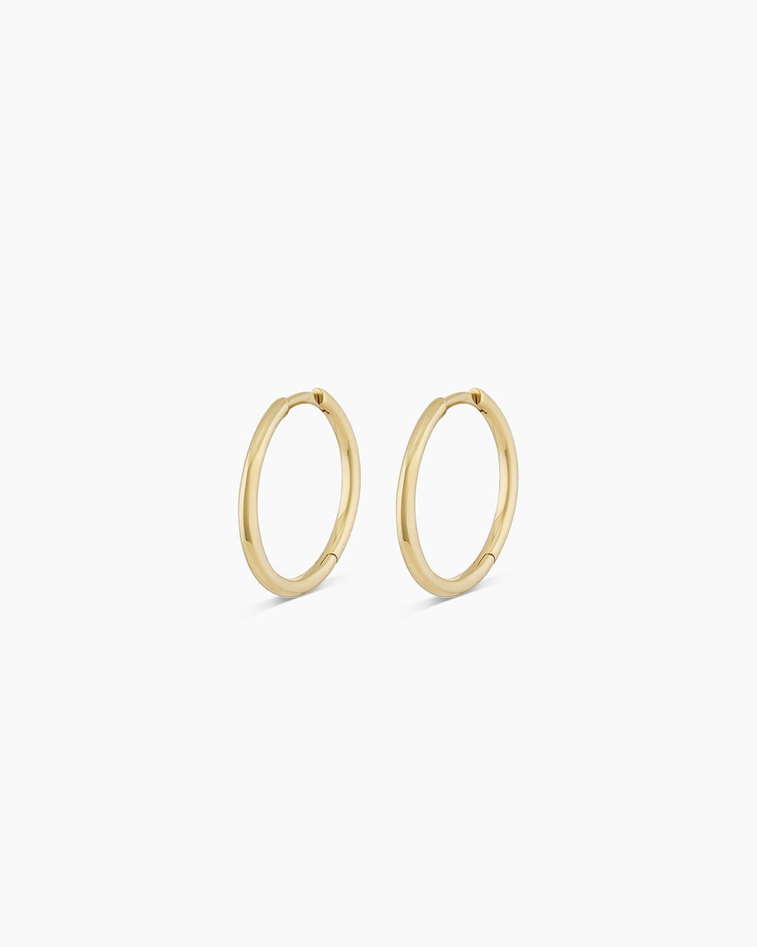 Woman wearing Classic Gold Huggie || option::14k Solid Gold, 15mm