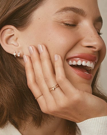 Woman wearing lab grown diamond earrings